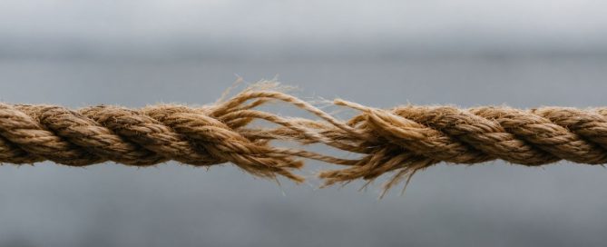 A strong rope beginning to fray in the middle, symbolizing how relapse can develop gradually before a return to drinking occurs.